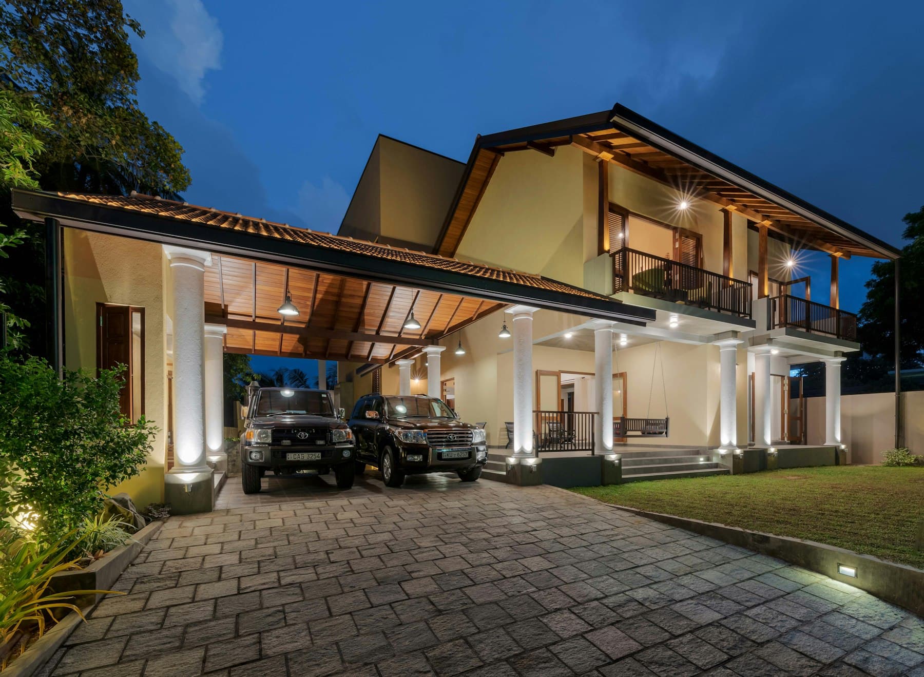 Architect-designed Colombo residence at twilight, colonnaded porch and tiled roof